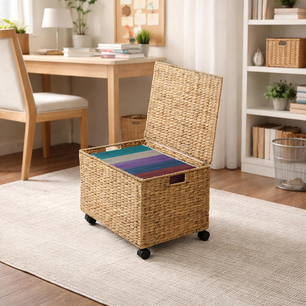 Junie woven file cabinet with lid open holding hanging files beside a desk